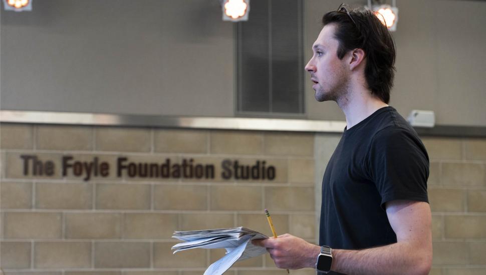 LAMDA student in a rehearsal room holding a script