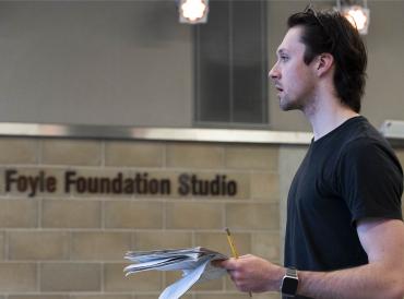 LAMDA student in a rehearsal room holding a script