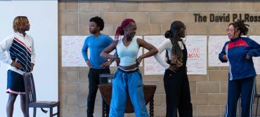 Students during rehearsals for Is God Is